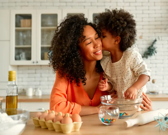 Mother and child baking